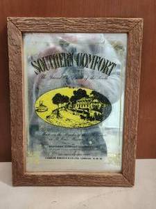 lot 88 image: Southern Comfort mirrored wall decor.