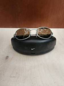 lot 65 image: Pair of Nike sunglasses and case