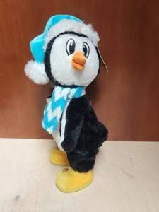 lot 135 image: Singing and Dancing Penguin - plays Christmas is my favorite rap
