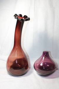 lot 20 image: Vintage Blenko American Art Glass Mid Century Modern Cranberry 14.5 curved Flower Vase. Also includes a Swedish purple art glass vase