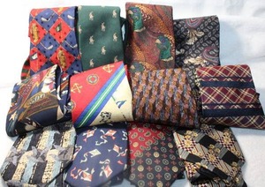 lot 22 image: (12) Novelty & Brand name ties. Includes Zegna, Etienne Aigner, Polo Ralph Lauren, Tommy Hilfiger (3), Golf and nautical themes, A gaming pinball motif tie, Pheasant tie, Kite and cigar motif and more