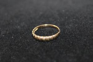 lot 102 image: 14K yellow gold ring. Marked 14K. Size 6. 1.3 gr approx.