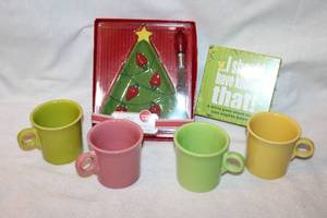 lot 41 image: Fiesta Coffee Mugs, Christmas plate with light up butter knife, and unopened game I should have known that