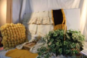lot 83 image: Vintage home Dcor curtains, afghan, pom-pom pillow and more