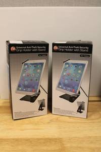 lot 38 image: (2) CTA Universal Anti-Theft Security Grip holder with stand for Tablets (Look used but have security cables)