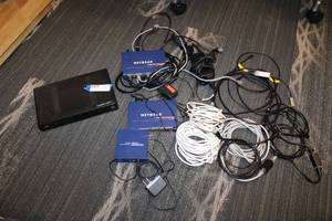 lot 18 image: Arris DCX3200 Cable Box, Netgear Switches (1) 5 port, (2) 8 ports Plus Misc. cables