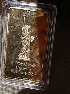 lot 31 image: Gold Toned Bar (One Once Gold Bar)