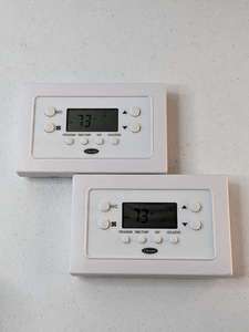 lot 204 image: Lot of 2 - Carrier TBPAC 5-2 Day Prog Thermostat