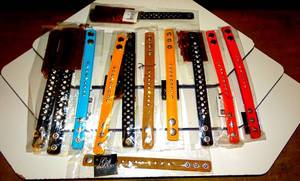 lot 28 image: STUDDED WRIST BRACELETS - ASSORTED COLORS (12X$)