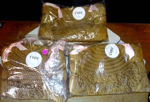 lot 133 image: NEW - PIXIE TAIL BRAIDED KNIT HATS - 6 UNITS X $