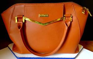 lot 254 image: JOY IMAN LEATHER PURSE IN EXCELLENT CONDITION $$
