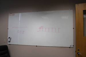 lot 132 image: LARGE White Glass whiteboard - 710W x 47H with mounting - needs removed, bring help
