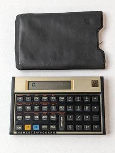 lot 34 image: Hewlett Packard HP 12C Financial Calculator w Soft Black Leather Case