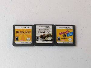 lot 262 image: Lot of 3 - Nintendo DS Games Brain Age, Personal Trainer Cooking, Ener-G Horse Riders