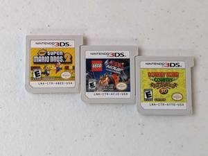 lot 296 image: Lot of 3 - Nintendo 3DS New Super Mario Bros 2, Lego Movie, Donkey Kong Country Returns 3D