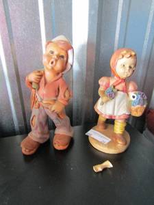 lot 26 image: BOY AND GIRL PORCELAIN DOLLS BOY 10 IN TALL GIRL 8IN TALL WITH DAMAGED ARM PIECE INCLUDED TO BE REPAIRED