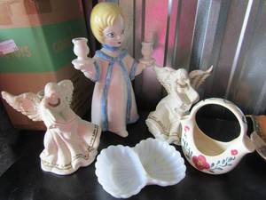 lot 38 image: 2 ceramic angels one has a broken wing, angel candle stand, and a handmade floral dcor glass basket