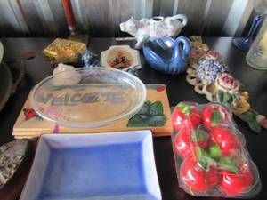 lot 46 image: handled glass cow creamer dish, music piano trinket, 2 blue dino dcor, blue glass stoneware plate, candle stick holder and more