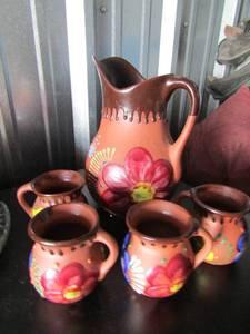 lot 5 image: hand painted handled pitcher with 4 matching handled cups made with red clay - pitcher - 10 in tall cups - 4 in tall