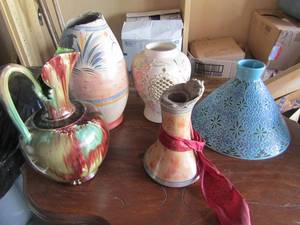 lot 57 image: 4 various types of clay pottery vases all need repair one has butterflys , owls, pictures says it all
