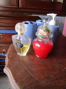 lot 67 image: 2 purple tooth brush holder and soap dispenser, peppermint candle, eau de cologne shalimar guerlain