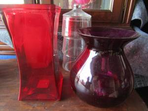 lot 68 image: 3 flower vases one purple one red one pink and a 3 tier stackable candy dish with lid