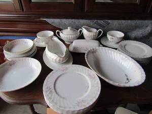 lot 74 image: gold standered genuine China with pink rose design 9 dinner plates 2 tea cups with saucers, gravy boat, sugercreamer,covered butter dish, various other saucers and bowls