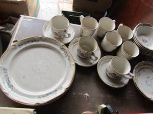 lot 97 image: heartland stoneware dishes 2 different patterns 8 coffee cups, 4 dinner plates, 3 cup saucers, 6 cereal bowls, 2 bread plates