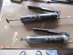 lot 105 image: Hand pump grease guns qty 2, unknown working condition appears to be good