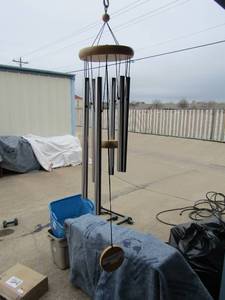 lot 120 image: Outdoor patio wind chime, sound is amazing, great condition-- 29 long from top to bottom
