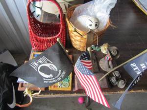 lot 172 image: home dcor lot includes 2 wicker baskets, various seashells, veteren flags with stand, 4 small hanging wooden painting and more