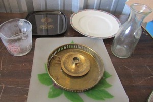 lot 200 image: measuring cup, couroc dcor plate, gold candle holder, clear glass milk canister and more