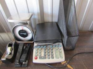 lot 219 image: office lot includes a calculator, paper holder, tape dispenser, 2 staplers, and a scale