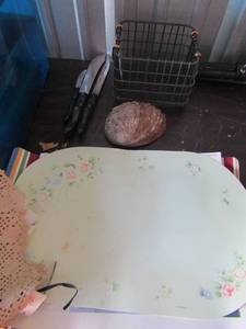 lot 233 image: Cutco knifes qty 3, sea shell, wicker metal basket, table Place mats various sets and singles, random dollies and cloth knapkins
