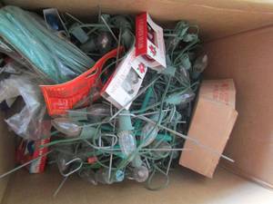lot 249 image: Random Christmas lights for outside and loose replacemnet bulbs, hooks for hanging included