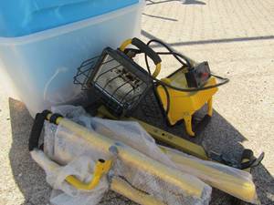 lot 294 image: 2 yellow work shop lights both comes with stands new, also can be hung up