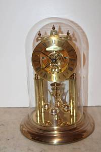 lot 30 image: Elgin Anniversary Clock with glass dome, Engravement reads S Haller made in Germany One Jewel Unadjusted, see pictures