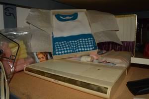 lot 46 image: Vintage Estee Lauder make up kit, Acrylic sweater, Baby nylon yarn set in case