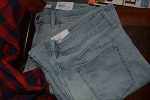 lot 62 image: Womens clothes still with tags Jeans sizes 12,14, Plaid shirts size M, Lauren tops size L, Levi jeans 10 Mis M and more