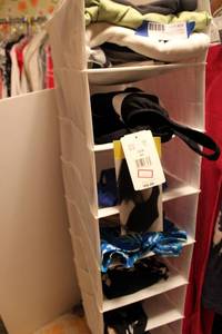 lot 24 image: Hanging closet organizer and swimwear (some still have tags) size 6-10