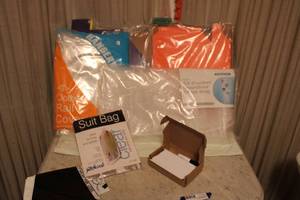 lot 25 image: Closet organizers SIP Suit cover, overdoor shoe bag, Clothes rail cover, Colored magazine boxes