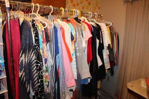 lot 27 image: Rolling clothes rack PLUS clothes (Generous amount, many still have tags)