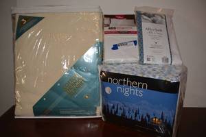 lot 112 image: Bed Linens - flannel sheet set with blue flowers, pillowcase and cover, and cotton thermal blanket
