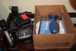 lot 156 image: Electronics - Print server, Emerson alarm clock radios, flashlight, and router