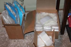 lot 174 image: Small clear bags in generous amount and clothes rail covers
