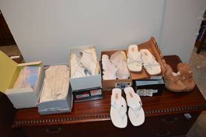 lot 215 image: Womens Shoes - white tennies and sandals Some look new unused. Plus fuzzy plaid slippers.