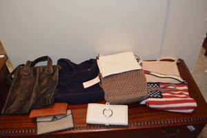 lot 207 image: Purses and wallets - includes crocheted flag and Sak purses.