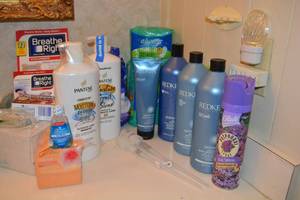 lot 238 image: Bathroom shampoos and more - Redken bottles are full, Pantene unopened and more