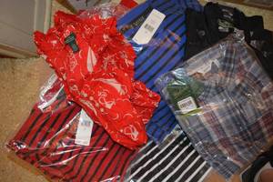 lot 240 image: Womens clothes - most still have tags. Mostly tops. Pair of jeans and jacket vest