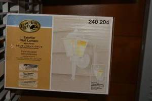 lot 255 image: Exterior Wall Lantern by Hampton Bay SIP. Look unused.